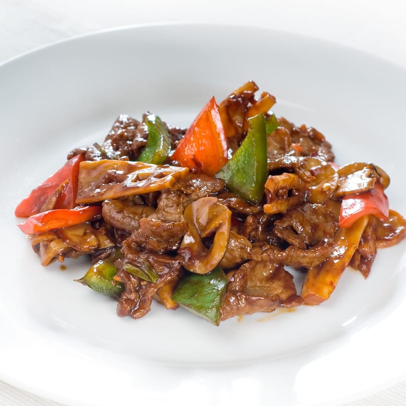 Great Wall Restaurant's Chinese beef stir-fry with red and green bell peppers and mushrooms.
